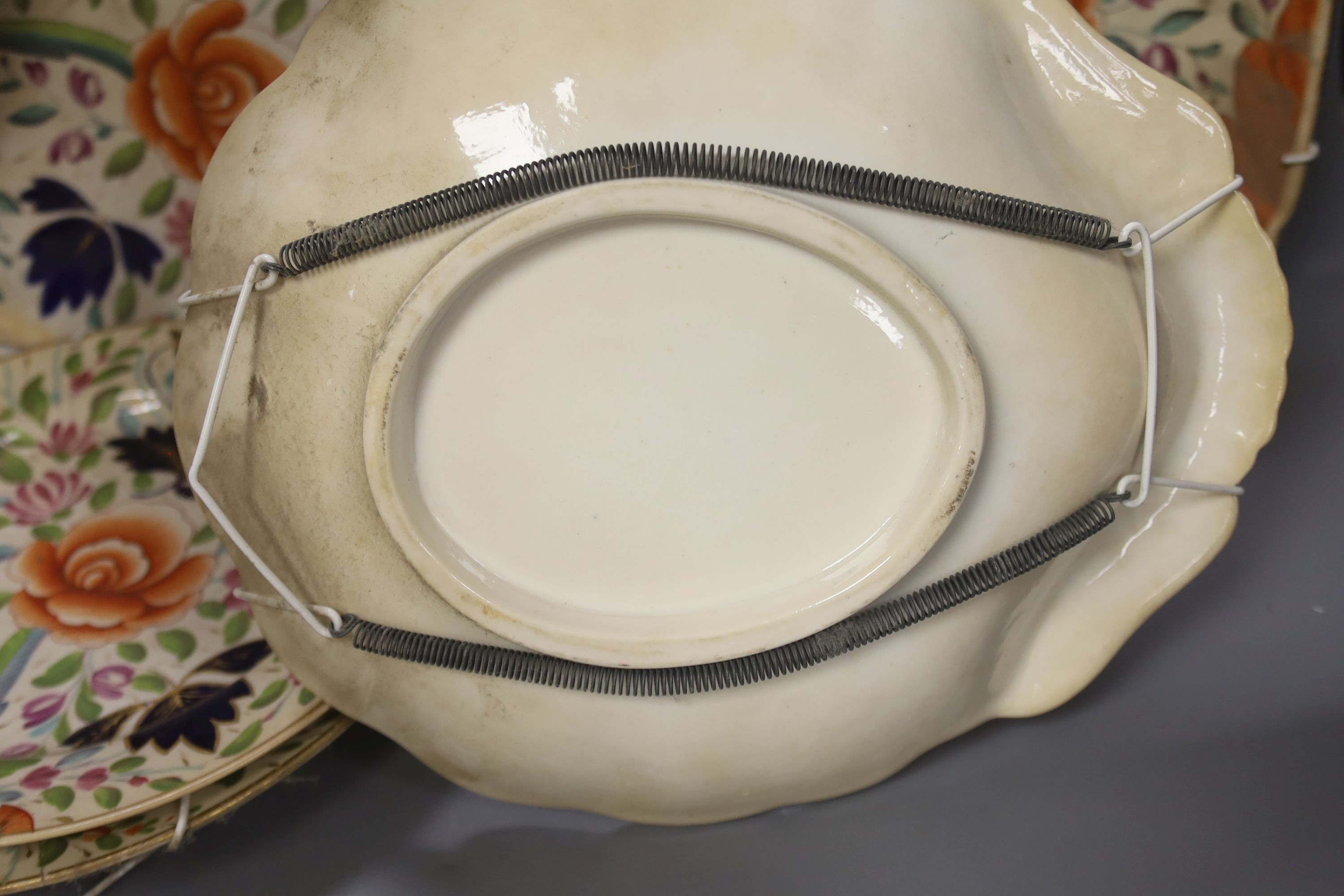 A Coalport porcelain part dessert service, circa 1820, painted with stylised flowers comprising two shell shaped dishes, square dish and two plates (5)